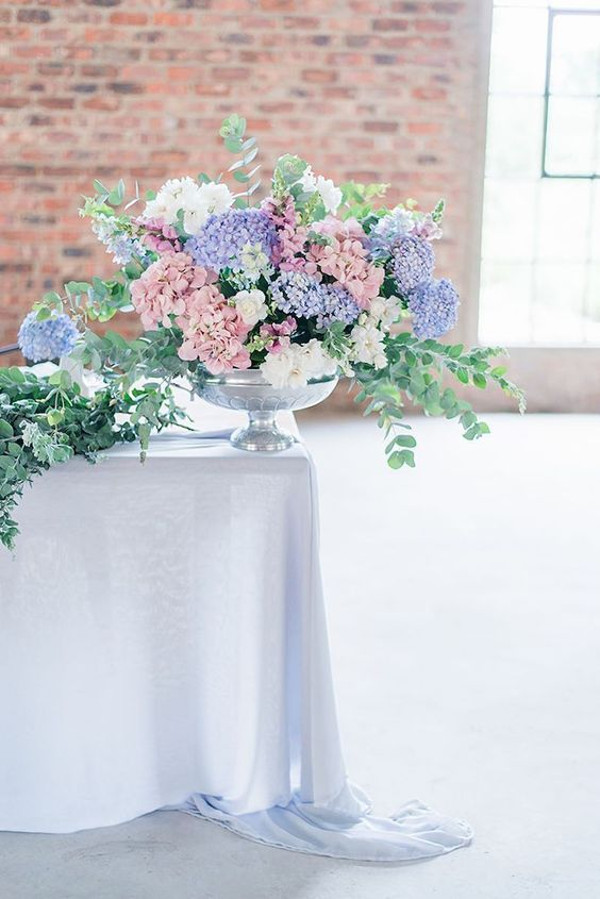 Blue and pink hydrangeas in a floral display