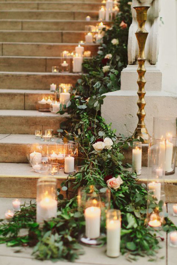 wedding staircase garland with greenery and candles