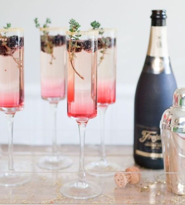 Blackberry thyme cocktail in champagne flute