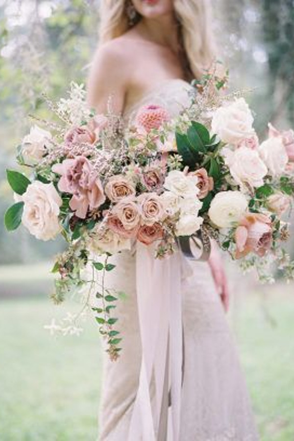 Brides bouquet using spring blossom, blush, pale pink and greenery