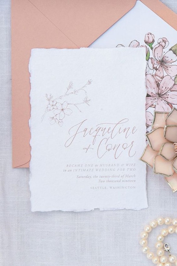 Blossom inspired hand drawn wedding invitation in blush