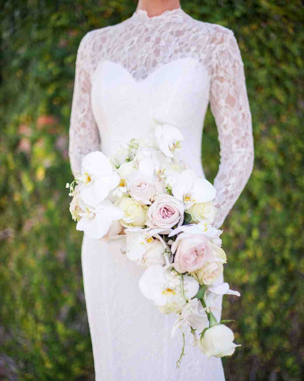 Cascading wedding bouquet of pale pink and blush roses