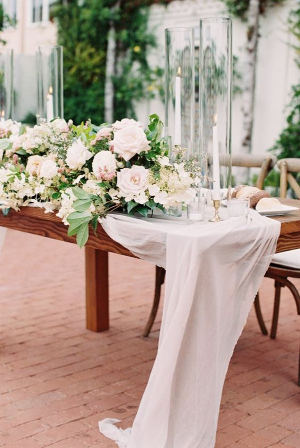 garden wedding tablescape with candles and flowers